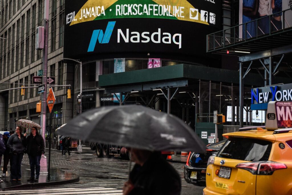 Nasdaq soars to a record high and is on track for its biggest annual gain since 2009