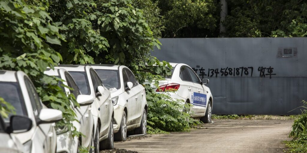 No one wants to buy used EVs and they’re piling up in weed-infested graveyards